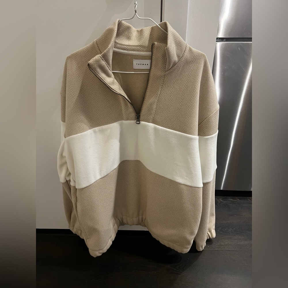 Beige/ tan sweater with white stripped design. Really cozy on the inside